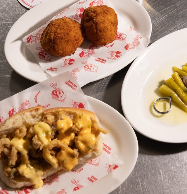 Croquetas, fried squid sandwich and piparra peppers at the bar