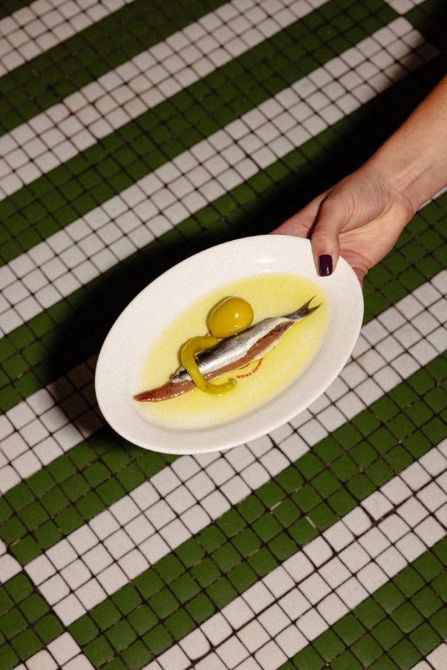 Matrimonio of white anchovy and anchovy on green and white mosaic tiles